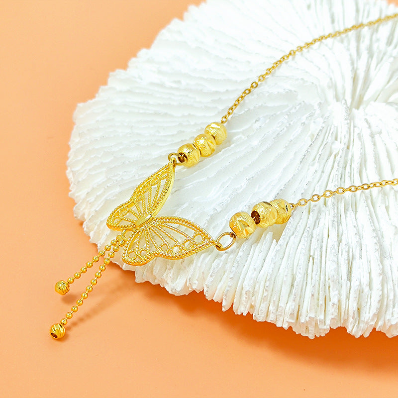 Golden Cut-Out Butterfly Necklace with Tassels